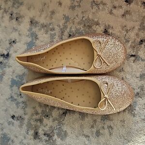 Glittery gold ballet shoe